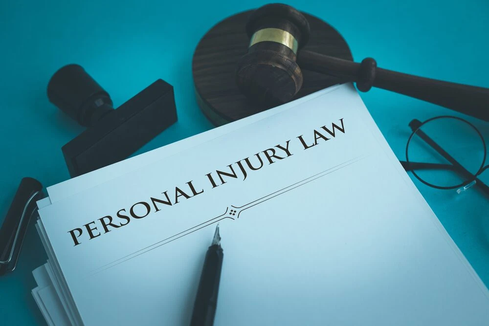 Paper that says "personal injury law".
