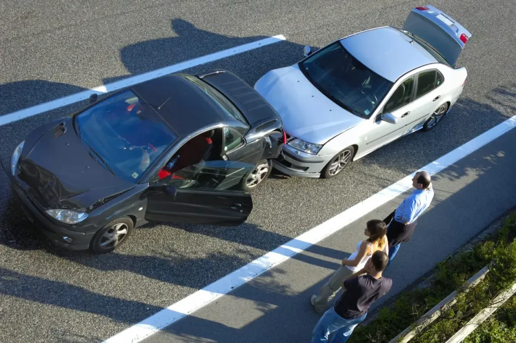 Two cars involved in a fender bender. If you've been injured in a car accident, contact a Houston car accident attorney.