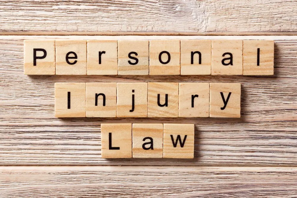Scrabble tiles spelling "personal injury law".